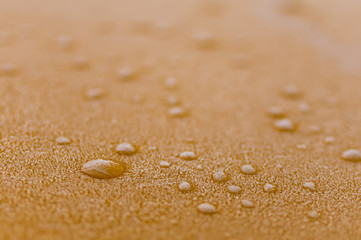Fototapeta na wymiar drops on sand
