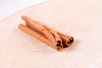 Cinnamon sticks on a wooden background	
