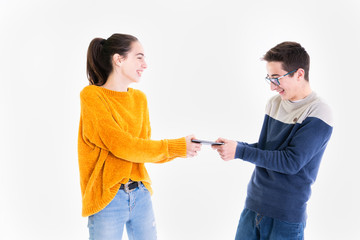 Standing teenagers joyfully fight for a smartphone
