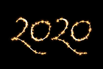 2020 text overlay of sparklers. festive new year text. 