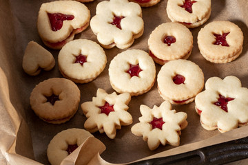 Linzer Christmas cookies filled with red currant marmalade