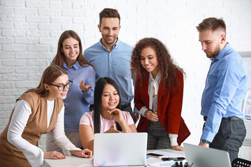 Colleagues discussing issue at business meeting in office