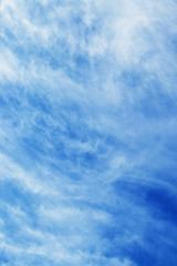 Abstract background with clouds of uncertain shape in blue sky_