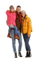 Fototapeta premium Happy family in winter clothes on white background
