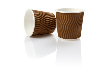 Eco - friendly background cups isolated on white . Disposable tableware.