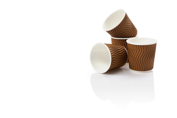 Eco - friendly background cups isolated on white . Disposable tableware.