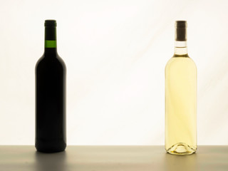 Close up of two bottles of wine unlabelled