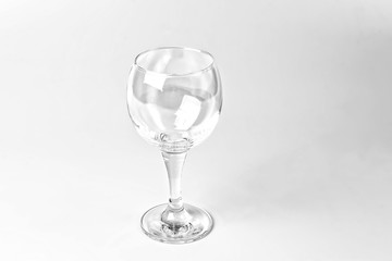 Empty wine glass on a white background