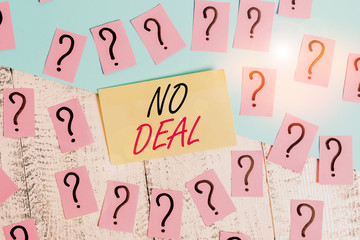 Conceptual hand writing showing No Deal. Concept meaning a negative result on agreement or an arrangement like in business Crumbling papers with thick cardboard on the wooden table