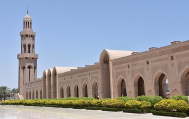 Fototapeta na wymiar Long Arabesque Arcade with Minaret at Far End