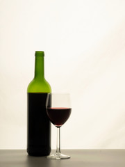 Close up of red wine with glass a bottle of red wine