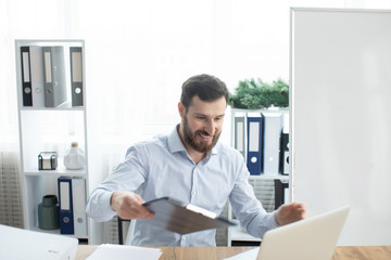 Fototapeta premium Bearded man working in the office.