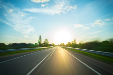 A journey through the rural road to the sun, motion blur