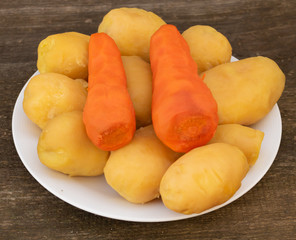 Boiled potatoes and carrots cooking process. Natural food