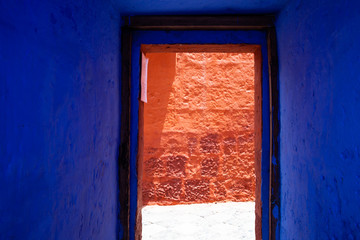 Blue, indigo, doorway overlooking the red wall