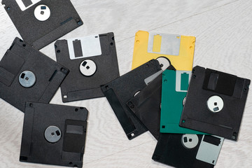 Old diskettes lie on the floor.