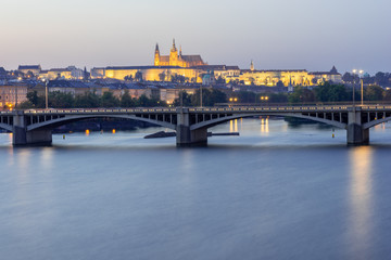 View on Prague castle over bridges at blue hour