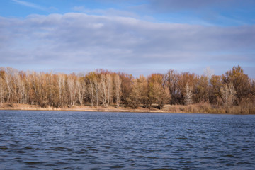 Autumn day landscape with a river