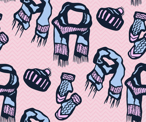 Seamless pattern with knitted mittens, scarf and hats. Ornamental decorative background. Vector pattern. Print for textile, cloth, wallpaper, scrapbooking