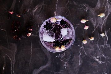 Pink Gin and Tonic cocktail with Hibiscus and Dried Rose Buds
