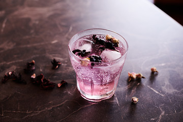Pink Gin and Tonic cocktail with Hibiscus and Dried Rose Buds
