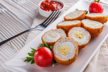 Scotch egg meat balls on rustic wooden background