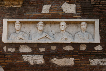  ancient tombs, with friezes, statues, and Latin inscriptions, along the Appian Way, in a park mainly surrounded by pine and cypress trees.