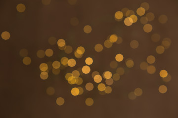 Abstract pasting circular gold luxury gold glitter bokeh lights background. Magic background. Holiday. An explosion of Golden confetti. Golden Christmas abstract texture of grainy.