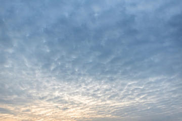 blue sky background with tiny clouds