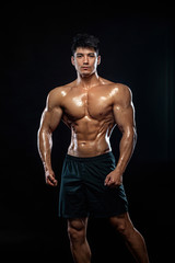 Fototapeta na wymiar Athlete bodybuilder. Strong and fit man. Sporty muscular guy on black background. Sport and fitness motivation. Individual sports recreation.