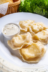 traditional Ukrainian dish of dumplings with sour cream