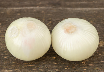 Onions benefits and properties concept. Onion on wooden background