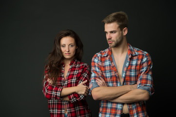 Country style. Woman and man wear checkered shirt. Rustic and country. Sexy people. Youth fashion. Fashionable outfit. Simple casual clothes. Couple feeling comfortable. Country music concept