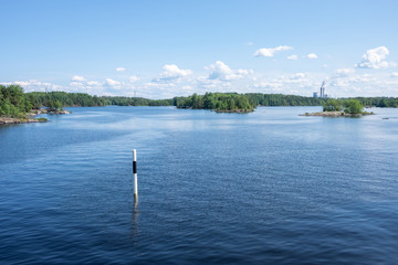 Beautiful view from the deck of the cruise ship going up the Lake Saimaa, Lappeenranta, Finland on a warm sunny day.