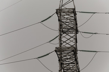 Cables and modular suspension insulators for overhead power line. Transmission tower. Metal...