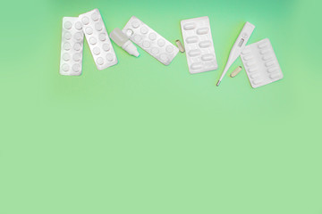 Tablets Vitamin pills and antibiotics on a colored background. Treating seasonal allergies, flu,...