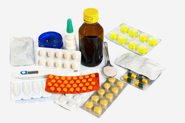 Flu and cold treatment - medicine in the form of tablets, ointments, aerosol and syrup, next to the...