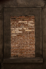 part of a brick wall in a cement frame