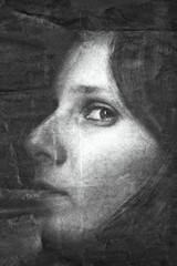 Woman portrait on old crumpled paper