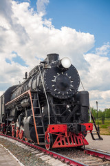 Fototapeta na wymiar vintage steam train hurtling at speed along the rails, retro vehicle, steam engine