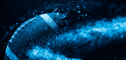 American football ball close up on black background. Blue filter - obrazy, fototapety, plakaty