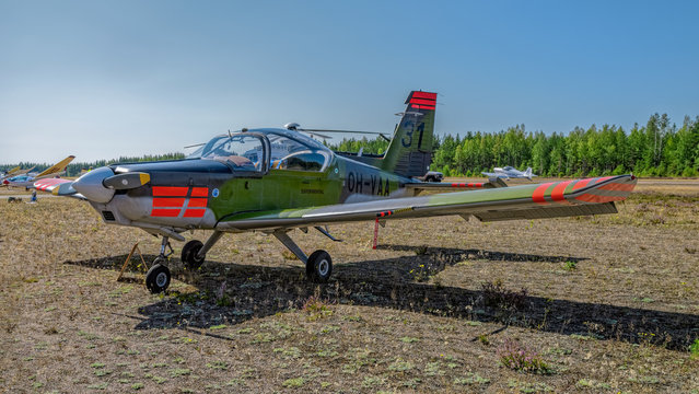 Finnish-designed single-engined piston-powered military basic trainer aircraft Valmet L-70 Miltrainer OH-VAA parked on Karhula aviation museum airshow. Kotka, Finland.