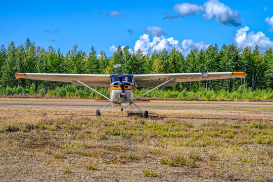 Four-seat light all-metal single-engined piston-powered airplane Cessna 170B OH-CWQ landing on Karhula aviation museum airshow. Kotka, Finland.