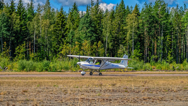 Two-seat single-engined piston-powered general aviation microlight aircraft Ikarus C42B OH-U459 landing on Karhula aviation museum airshow. Kotka, Finland.