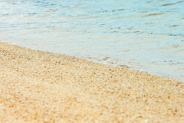 Fototapeta na wymiar beautiful footprints in the sand by the sea background