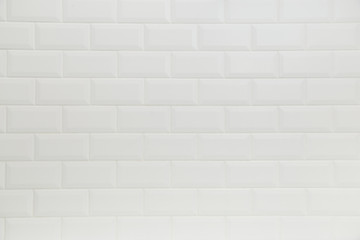Naklejka premium Bathroom wall tiled in scandinavian classic brick style with white grouting.