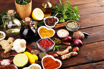 Spices and herbs on table. Food and cuisine ingredients with oil and vinegar