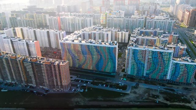 High rise buildings in new modern residential area, aerial view. Journey. Flying above the new colorful houses, concrete jungles concept.