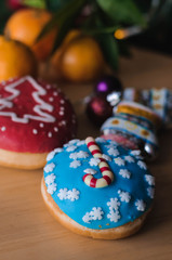 Christmas cakes on the table with tangerines
