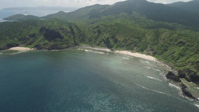 Aerial seascape coastline with beach tropical island Palau with mountains covered with rainforest and trees. Santa Ana, Philippines. view of island with wild beaches.